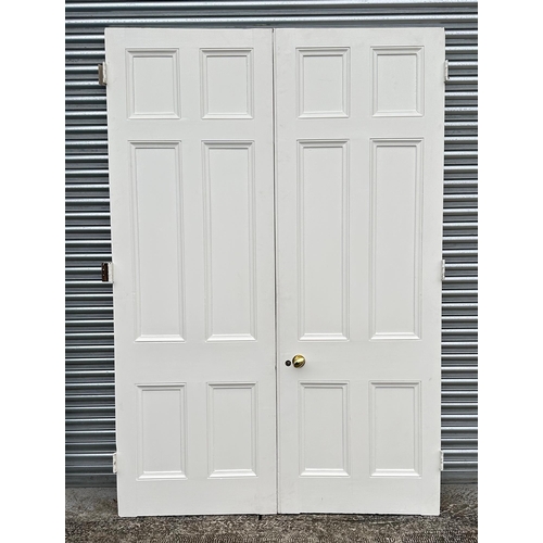 8 - A large pair of white painted panel doors, removed from a London property, each 88 by 256cm.