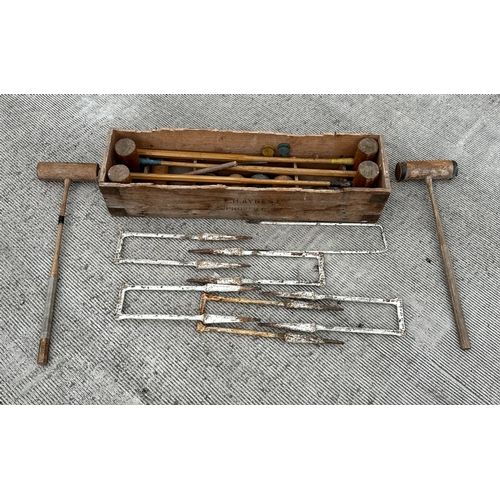 4 - An F H Ayres Limited vintage croquet set.
