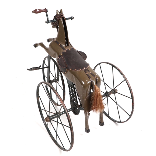 370 - A 19th century French child's horse tricycle Velocipede, with a carved painted wooden body, cast met... 