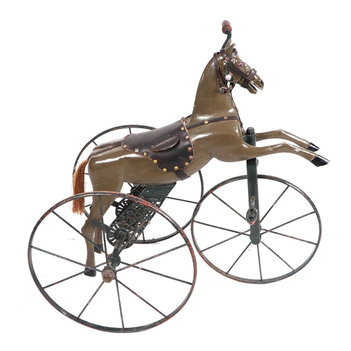 370 - A 19th century French child's horse tricycle Velocipede, with a carved painted wooden body, cast met... 