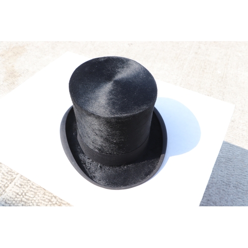 382 - A Tress & Co London silk top hat, 60cm circumference, together with a leather travelling case (2).