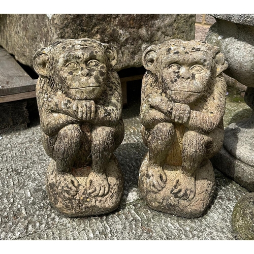 12 - A well weathered stoneware planter, 39cms wide; together with a group of garden ornaments.