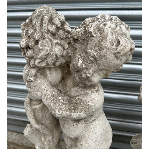 15 - A pair of 19th century composition Coade style stone putti, in well weathered condition, each approx... 