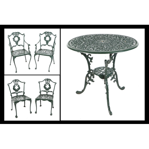 16 - A painted cast aluminium garden set consisting a table, two carver chairs and two chairs, the table ... 