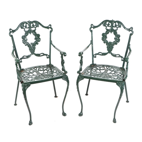 16 - A painted cast aluminium garden set consisting a table, two carver chairs and two chairs, the table ... 