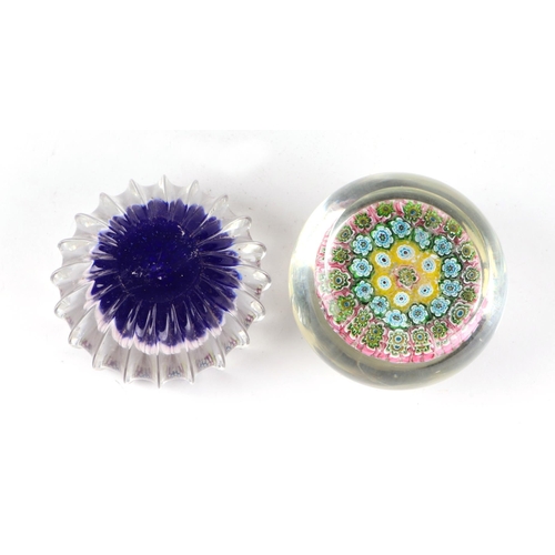 164 - A Baccarat style paperweight with floral canes, 6cms diameter; together with another similar, 6cms d... 