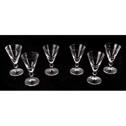 166 - A set of 12 cranberry glass wine glasses, with matching carafe, a celery vase, a pair of spiral twis... 