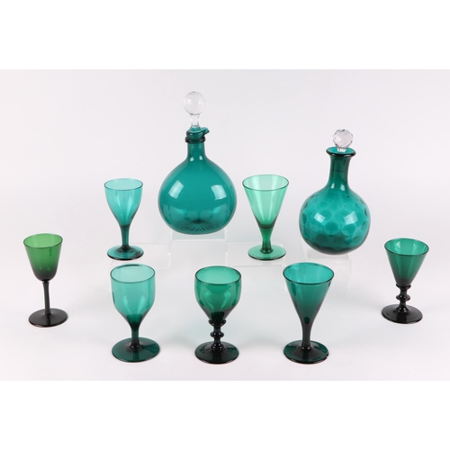 169 - A group of 1th century Bristol green and amethyst glasses; together with two similar decanters.