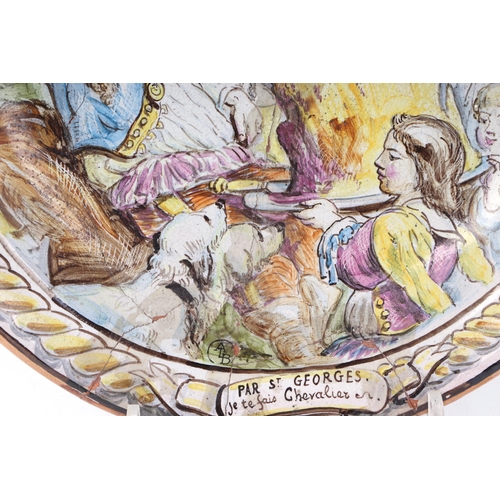 179 - A French faience pottery charger decorated with a tavern scene, with motto 'Par St Georges Je Te Fai... 