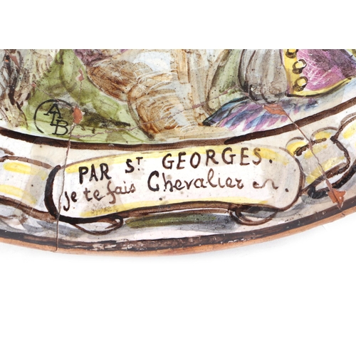 179 - A French faience pottery charger decorated with a tavern scene, with motto 'Par St Georges Je Te Fai... 