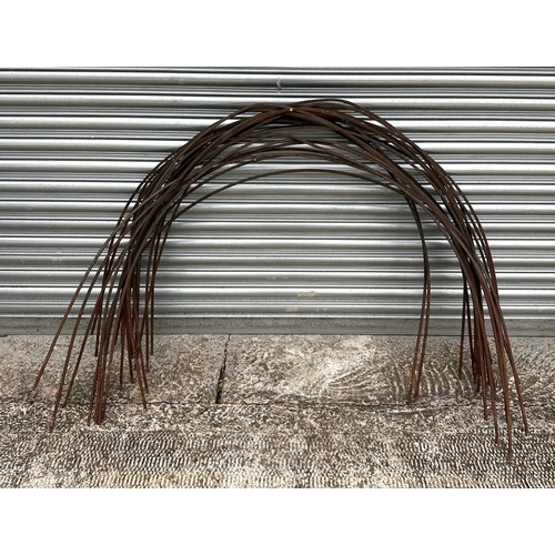 18 - A large quantity of well weathered iron garden hoop flower supports.