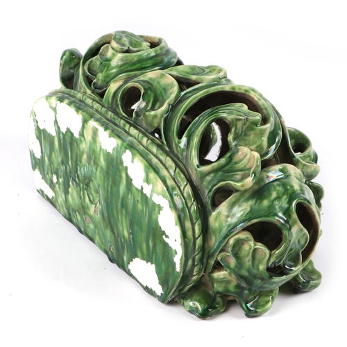 185 - A Rococo style green lustre glaze wall bracket, 30cms wide.