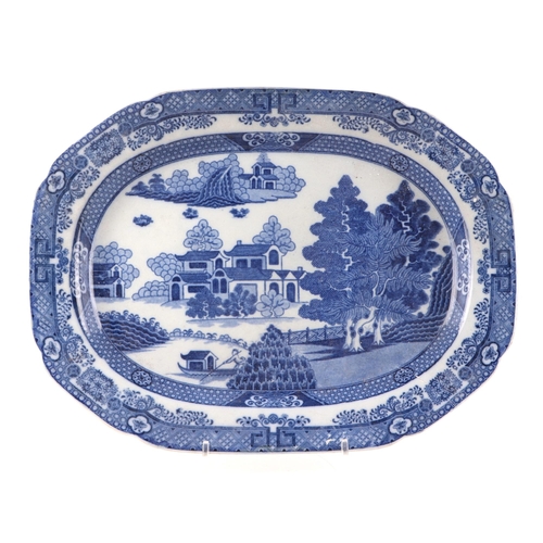 205 - A 19th century blue & white transfer decorated meat plate depicting a Chinese scene, 45cms wide; tog... 