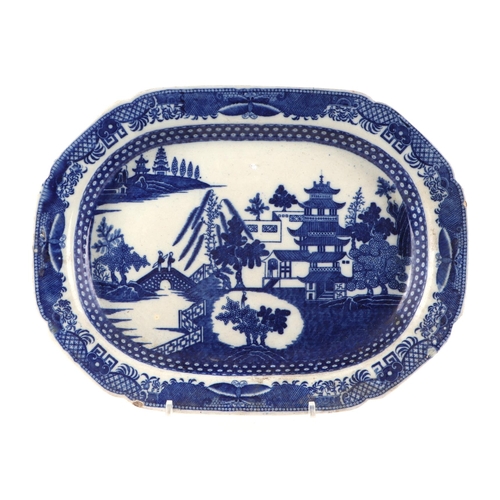 205 - A 19th century blue & white transfer decorated meat plate depicting a Chinese scene, 45cms wide; tog... 