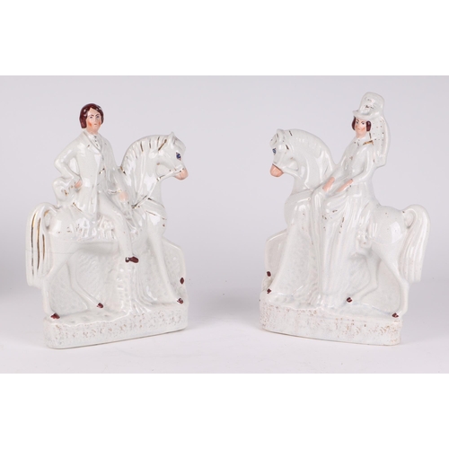 208 - A pair of Staffordshire flatback figures depicting a lady and gentleman on horseback, 19cms wide; to... 