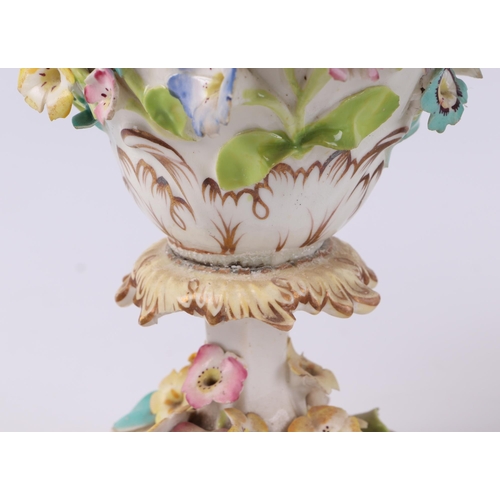 229 - A 19th century Coalport pot pourri and cover decorated with encrusted flowers, 28cms high; together ... 