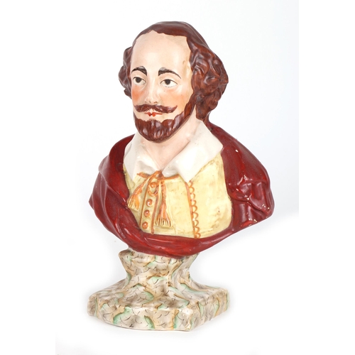 234 - A quantity of assorted ceramics to include a bust of William Shakespeare; a pair of horse head booke... 