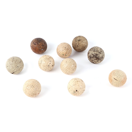 238 - Golfing interest:  A small quantity of vintage golf balls (10).