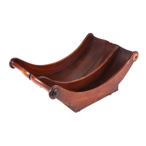 249 - A George III mahogany two-division cheese coaster of traditional form, on brass casters, 43cms wide.