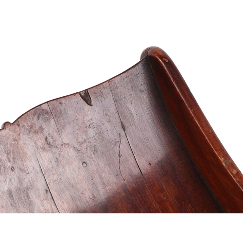 249 - A George III mahogany two-division cheese coaster of traditional form, on brass casters, 43cms wide.