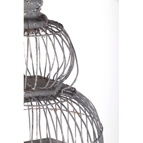 269 - A decorative painted wooden bird cage, 71cms high.