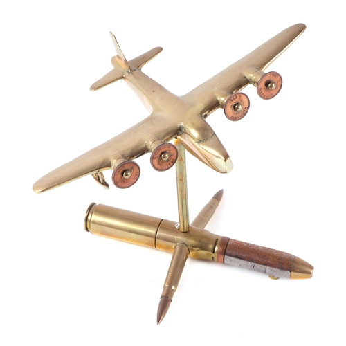 27 - A trench art cast brass model of a Sutherland aeroplane, mounted on a artillery shell case stand, wi... 