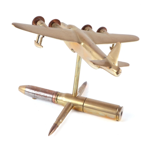 27 - A trench art cast brass model of a Sutherland aeroplane, mounted on a artillery shell case stand, wi... 