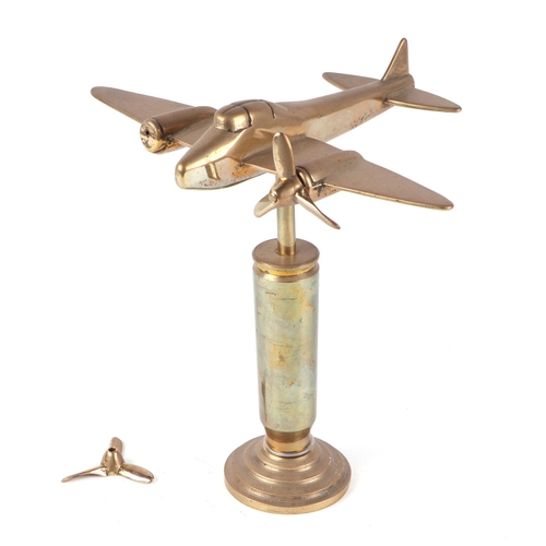 31 - A trench art cast brass model of Mosquito aircraft, mounted on a brass plinth, wingspan 20cm. Condit... 