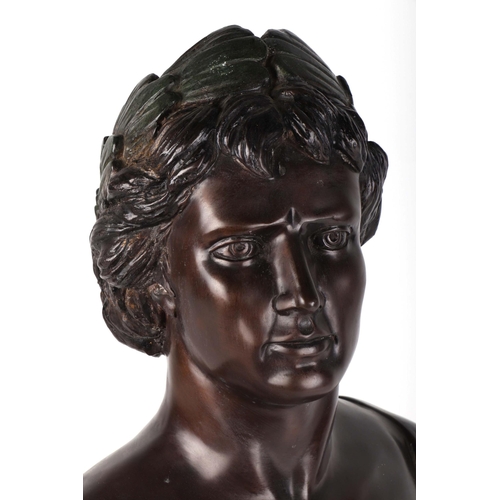 318 - After the antique:  A patinated cast bronze bust of a Roman Emperor, 63cms high.