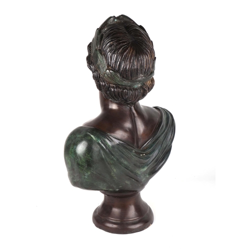 318 - After the antique:  A patinated cast bronze bust of a Roman Emperor, 63cms high.