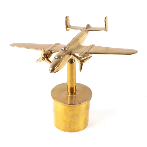 32 - A trench art cast brass model of a Mitchell aircraft, mounted on a brass shell case, 27cm diameter.