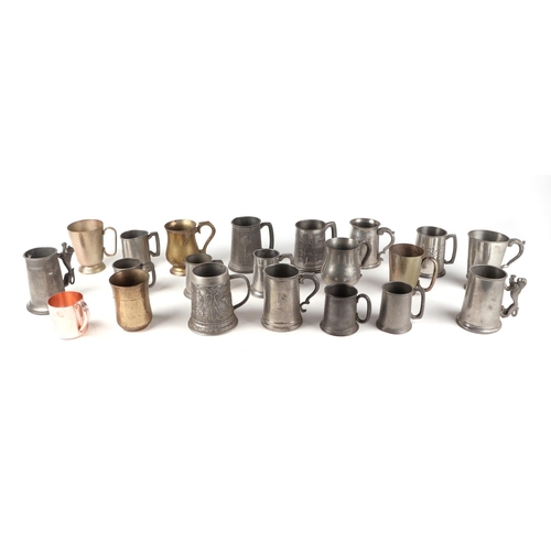 321 - A collection of pewter tankards and other metal wares.