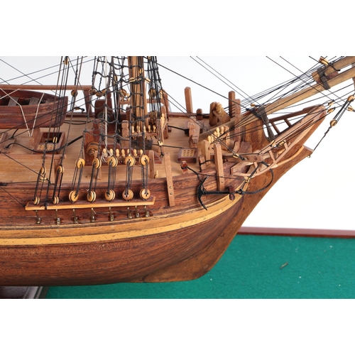 328 - A scratch built model of a three-masted sailing ship mounted in a display case, the model approx 72c... 