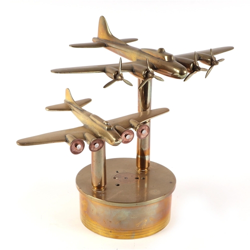 35 - A trench art brass pair of Flying Fortress Bombers, mounted on a brass artillery shell base, wingspa... 