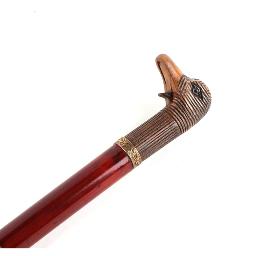 37 - A stained hardwood swordstick with a carved softwood mechanical handle in the form of a ducks head, ... 