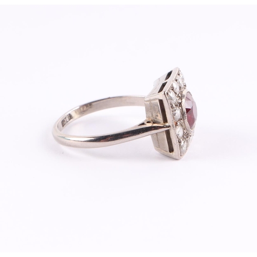 385 - An 18ct white gold Art Deco diamond and ruby ring, the central ruby approx 5.5mm diameter, approx UK... 