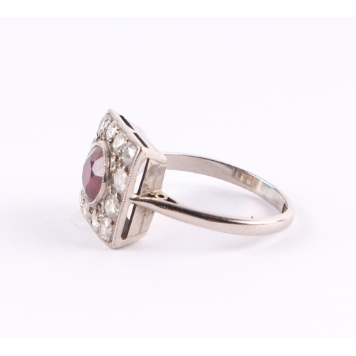 385 - An 18ct white gold Art Deco diamond and ruby ring, the central ruby approx 5.5mm diameter, approx UK... 