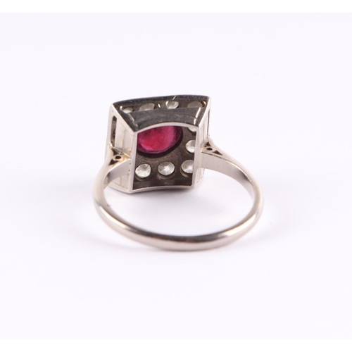 385 - An 18ct white gold Art Deco diamond and ruby ring, the central ruby approx 5.5mm diameter, approx UK... 