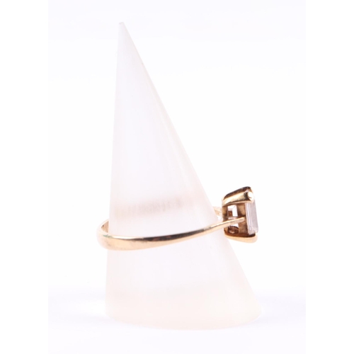 395 - A 9ct gold ring set with a large rectangular white stone, approx UK size P, 2g.