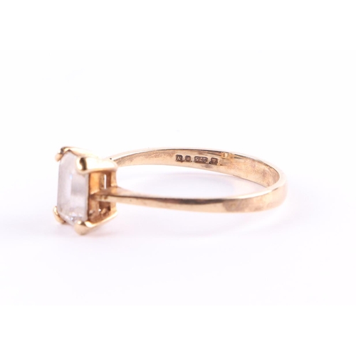 395 - A 9ct gold ring set with a large rectangular white stone, approx UK size P, 2g.