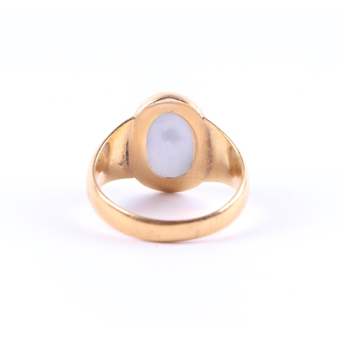 413 - A yellow metal signet ring set with an oval hardstone, approx UK size N, 5.7g.