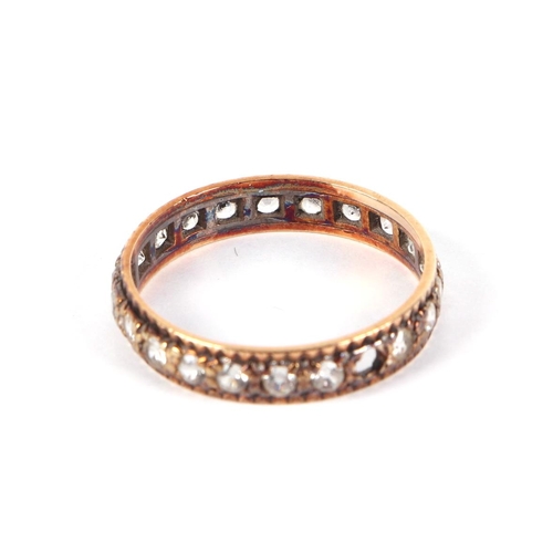 421 - A 9ct gold eternity ring set with white stones, approx UK size R, 2g.Condition ReportOne stone missi... 