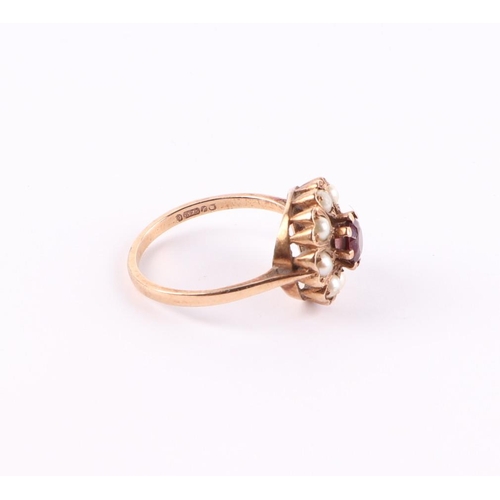 424 - A 9ct gold garnet and pearl cluster ring, approx UK size Q, 3.1g.