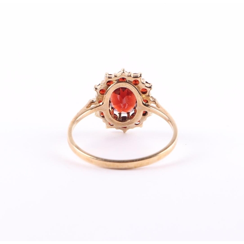 435 - A 9ct gold garnet cluster ring, approx UK size P, 2.1g.