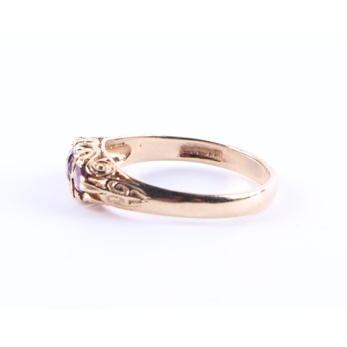 436 - A 9ct gold ring set with three amethysts interspersed with small diamonds, approx UK size P, 2.8g.