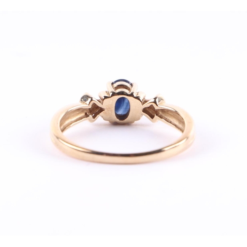 439 - A 9ct gold ring with central sapphire and two small diamond set shoulders, approx UK size N, 2.4g.