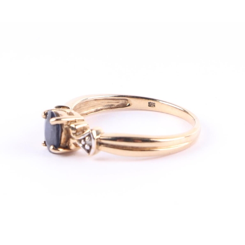 439 - A 9ct gold ring with central sapphire and two small diamond set shoulders, approx UK size N, 2.4g.