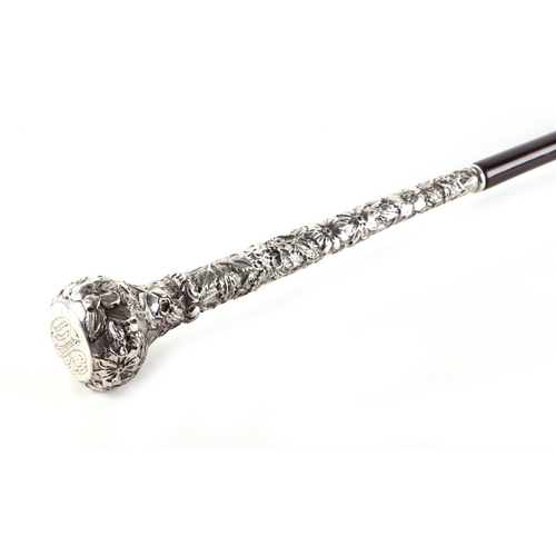 44 - A late 19th century partridge wood swordstick with ornate sterling silver handle, having a square ta... 