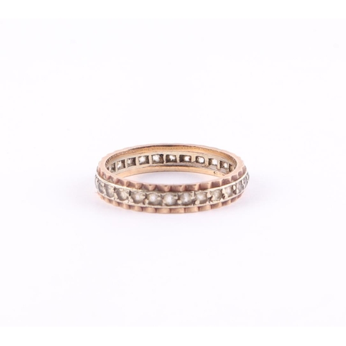 440 - A 9ct gold eternity ring set with white stones, approx UK size L, 1.5g.