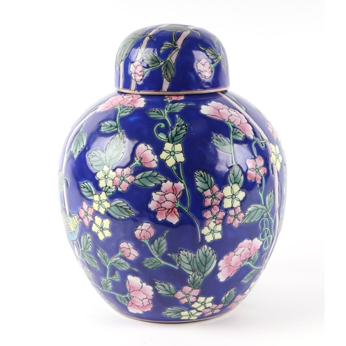 443 - A Chinese ginger jar and cover of ovoid form decorated in polychrome with exotic birds and flowers, ... 